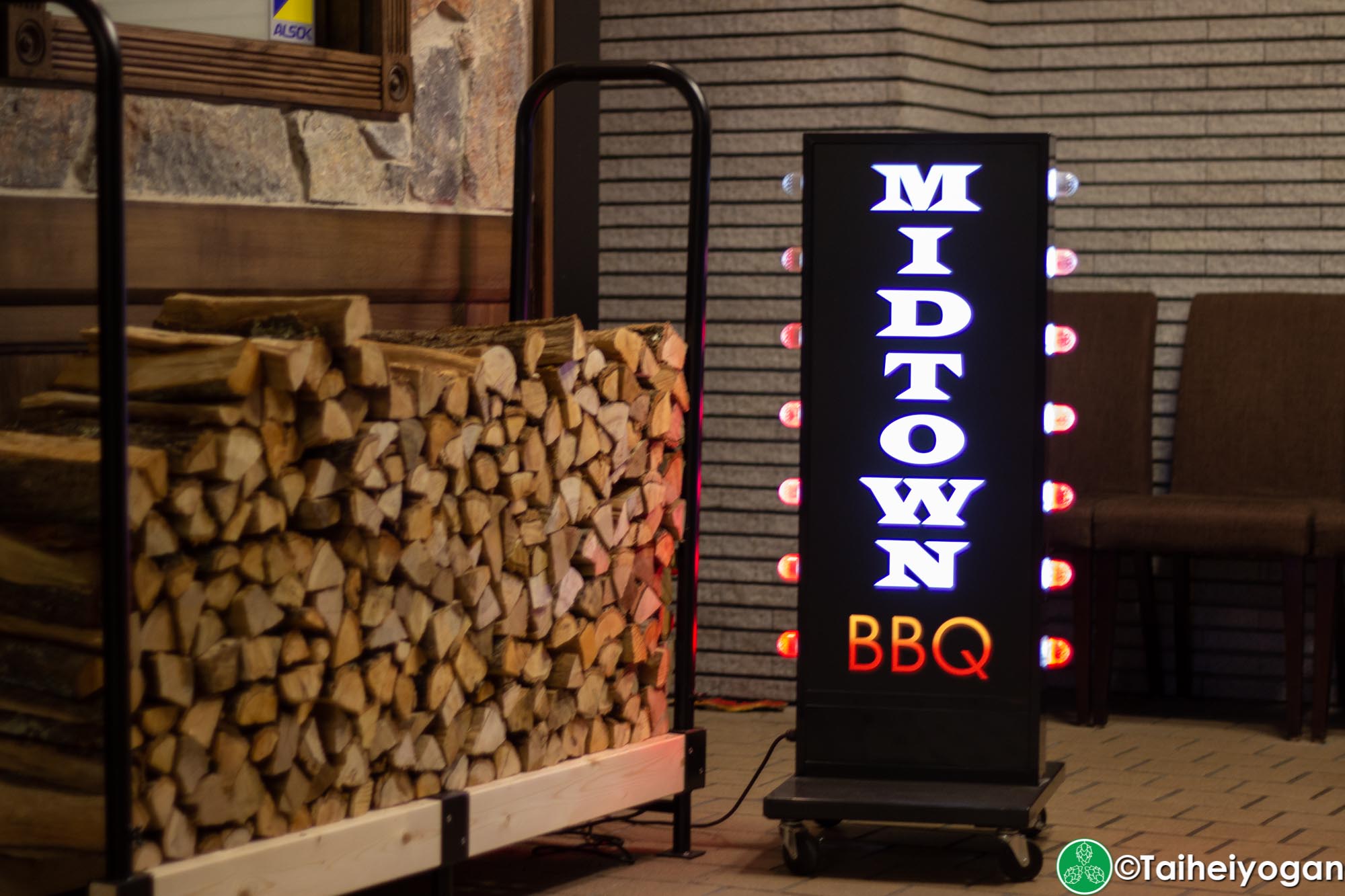 Midtown BBQ (Yokohama - 横浜店) - Entrance - Sign & Firewood